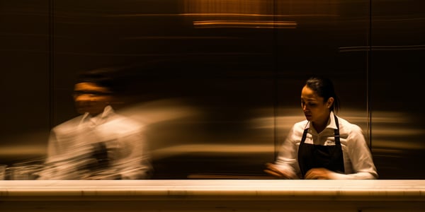 Two hotel staff doing labor forecasting