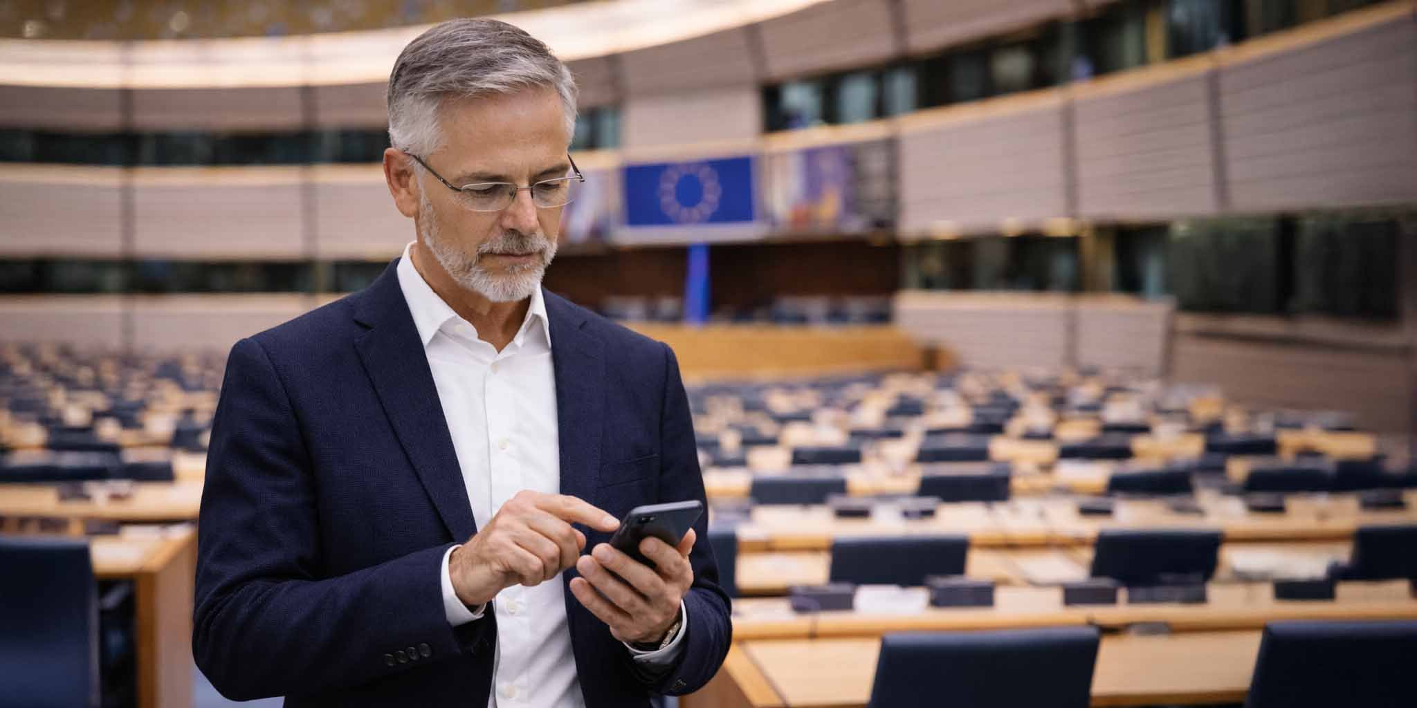 Man using his phone in the European parliament