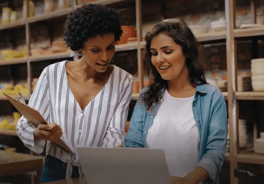 Retail staff looking at laptop