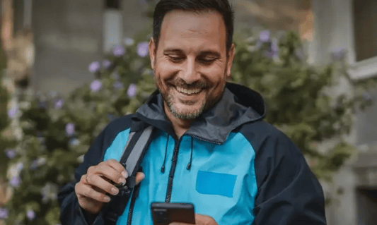 Forecasting built for real-world demand, man lookign at smartphone