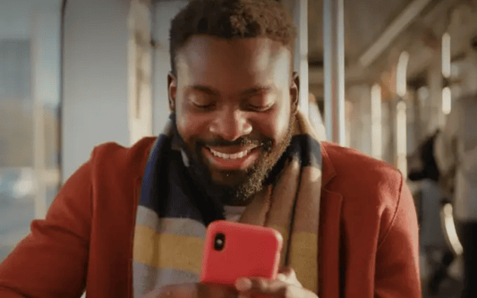 One connected employee experience, guy looking at smartphone