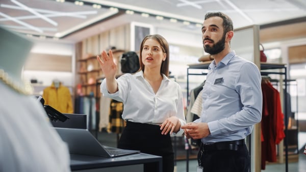 Retail workers in a clothing store